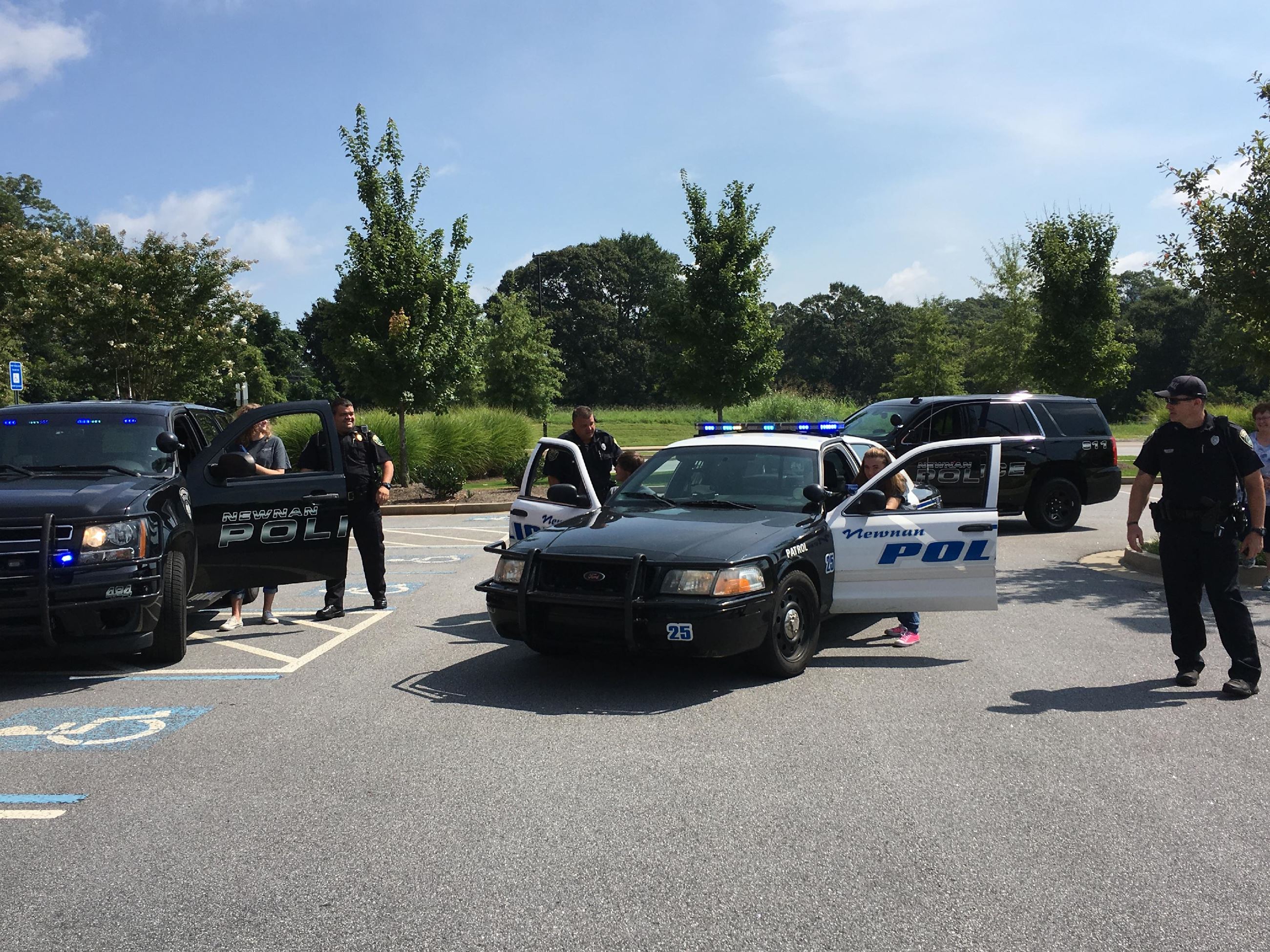 People in Police Cars